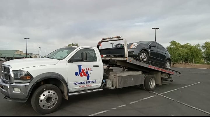 car being tow by j&v towing